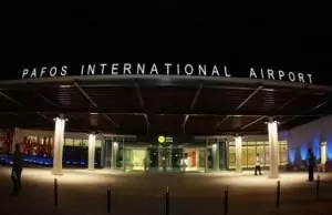 Paphos International Airport at night image.